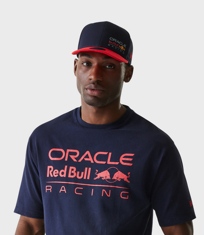 Portrait of a man wearing a navy cap with the Oracle Red Bull Racing logo on the front