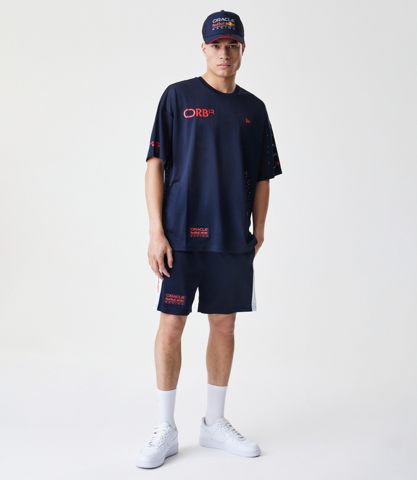 Male model in navy Oracle Red Bull Racing mesh tee with matching shorts and cap