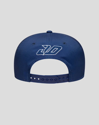 Back view of a blue New Era 9Seventy stretch snap cap with adjustable strap and white embroidered logo