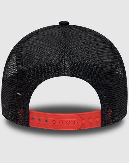 Back view of navy mesh trucker cap with bright red plastic adjustable strap