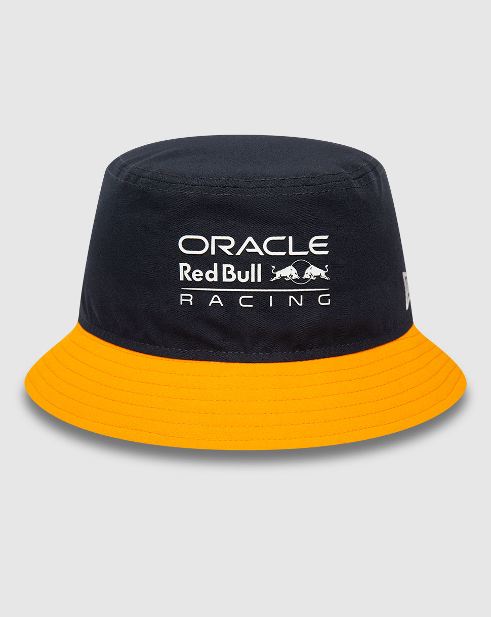Navy Red Bull Racing bucket hat with bright orange visor, front logo, and New Era flag on the left