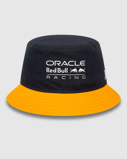Navy Red Bull Racing bucket hat with bright orange visor, front logo, and New Era flag on the left