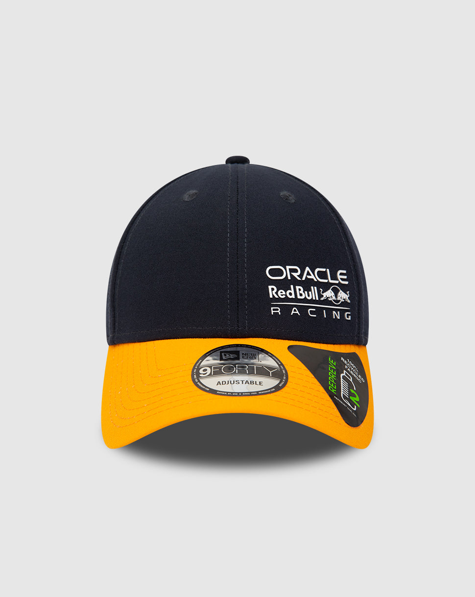 Navy Repreve 9FORTY cap with orange curved visor seen from front left showcasing Oracle Red Bull Racing logo