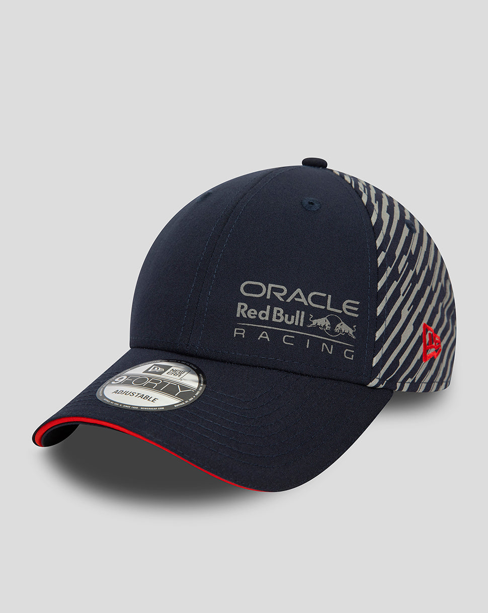 Navy New Era 9Forty cap with Oracle Red Bull Racing Las Vegas branding on the front and a diagonal striped back panel with a red brim edge.