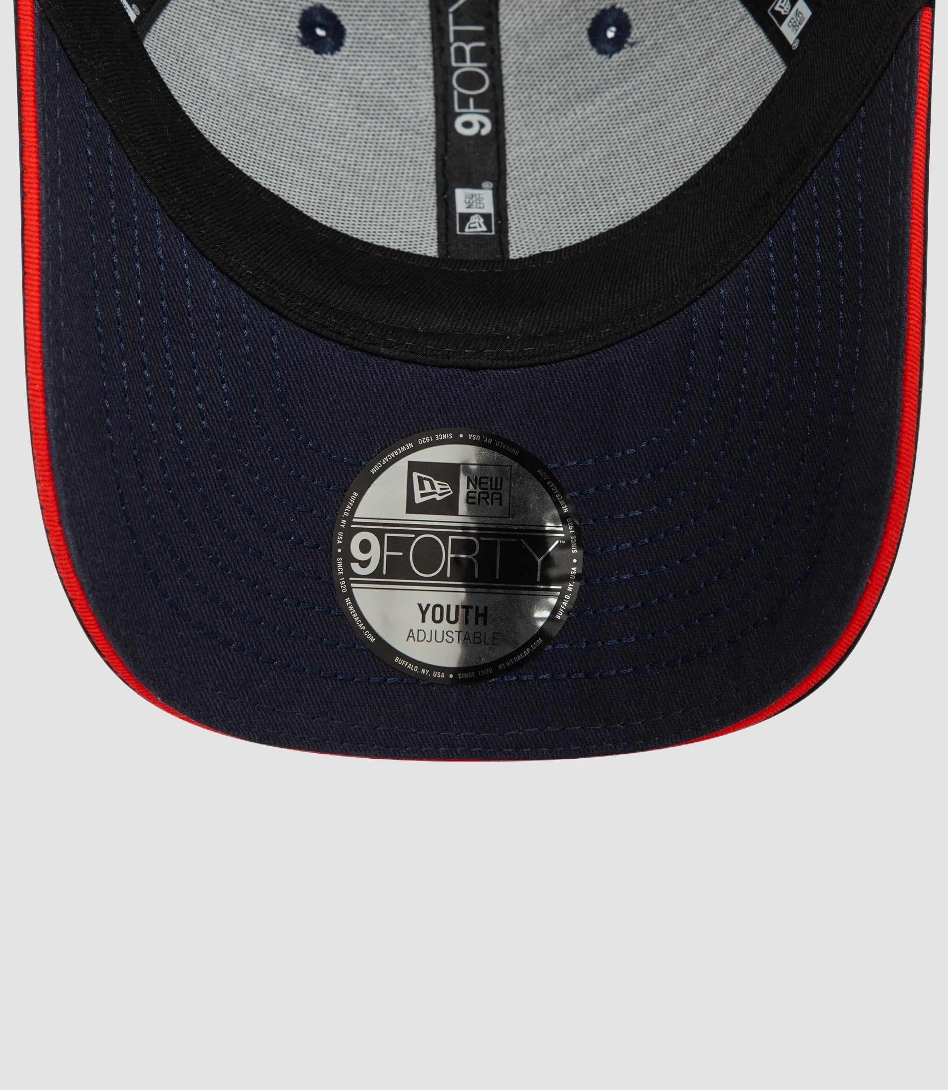 Back view of navy New Era 9Forty kids cap with adjustable strap and a 9FORTY Youth badge
