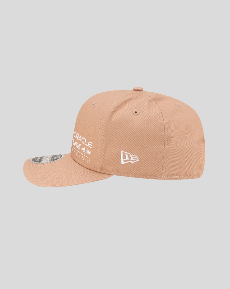 Side view of a peach colored Oracle Red Bull Racing 9Fifty cap with New Era logo