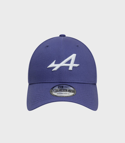 Front view of New Era Alpine 9Forty cap in dark blue with white front embroidery and brim sticker.