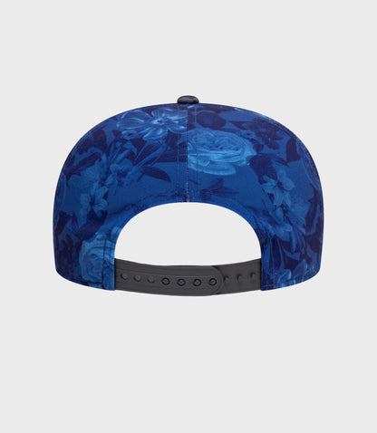 Front view of navy floral cap with top button and curved brim