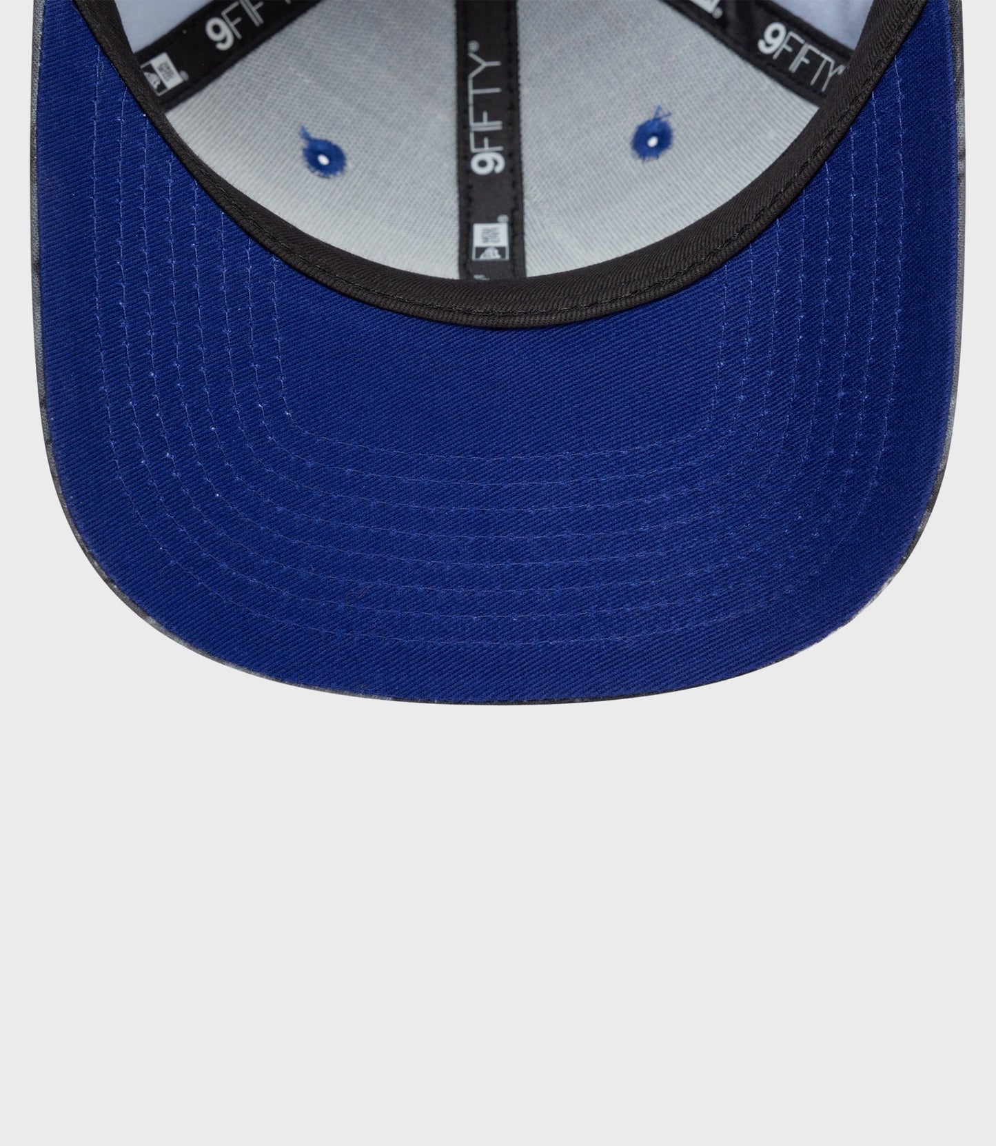 Back view of blue floral cap showing gray adjustable strap and inner crown details