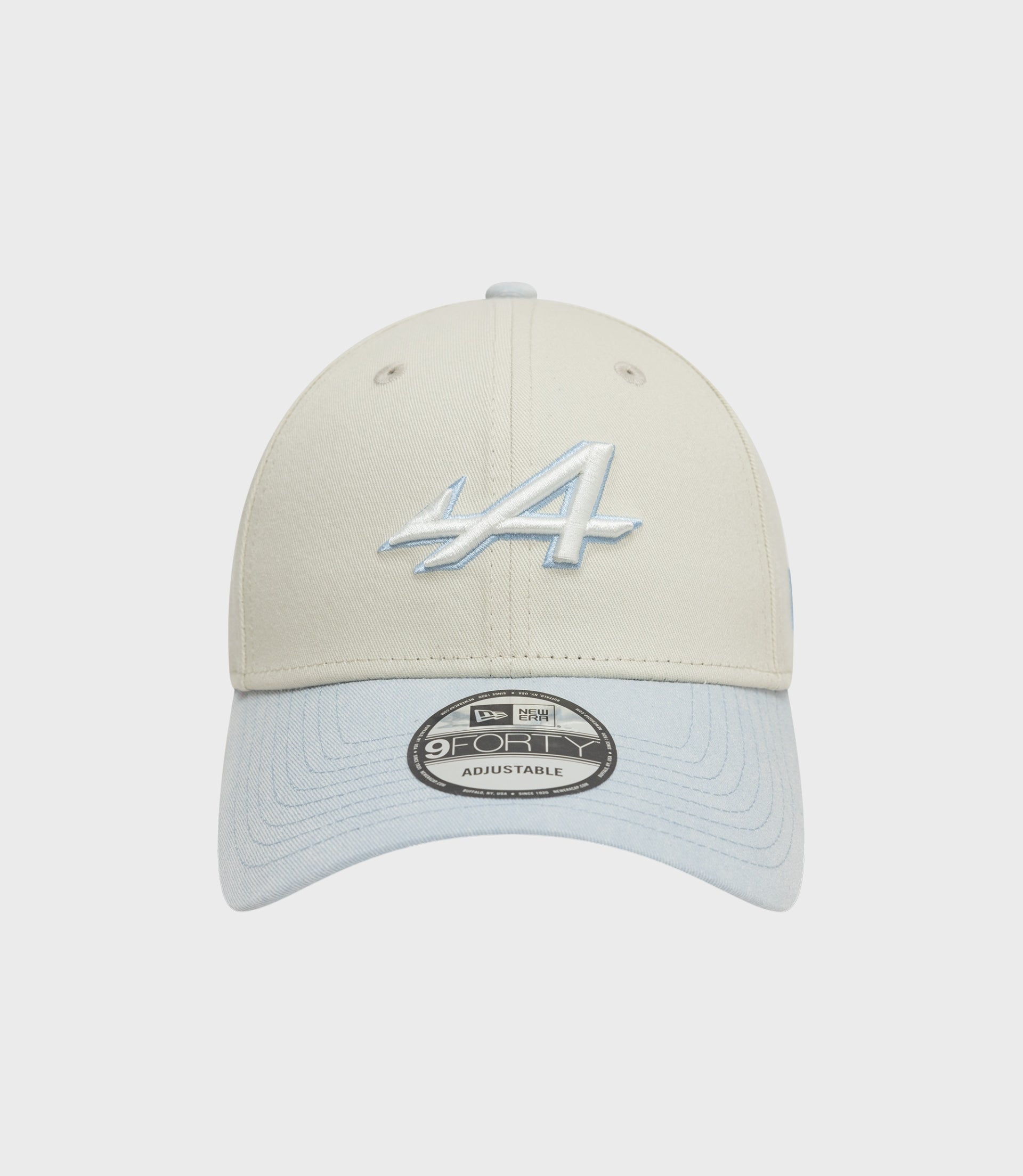 Front view of creme New Era Alpine Acid Wash 9Forty cap with light blue denim brim and pale blue embroidery on crown