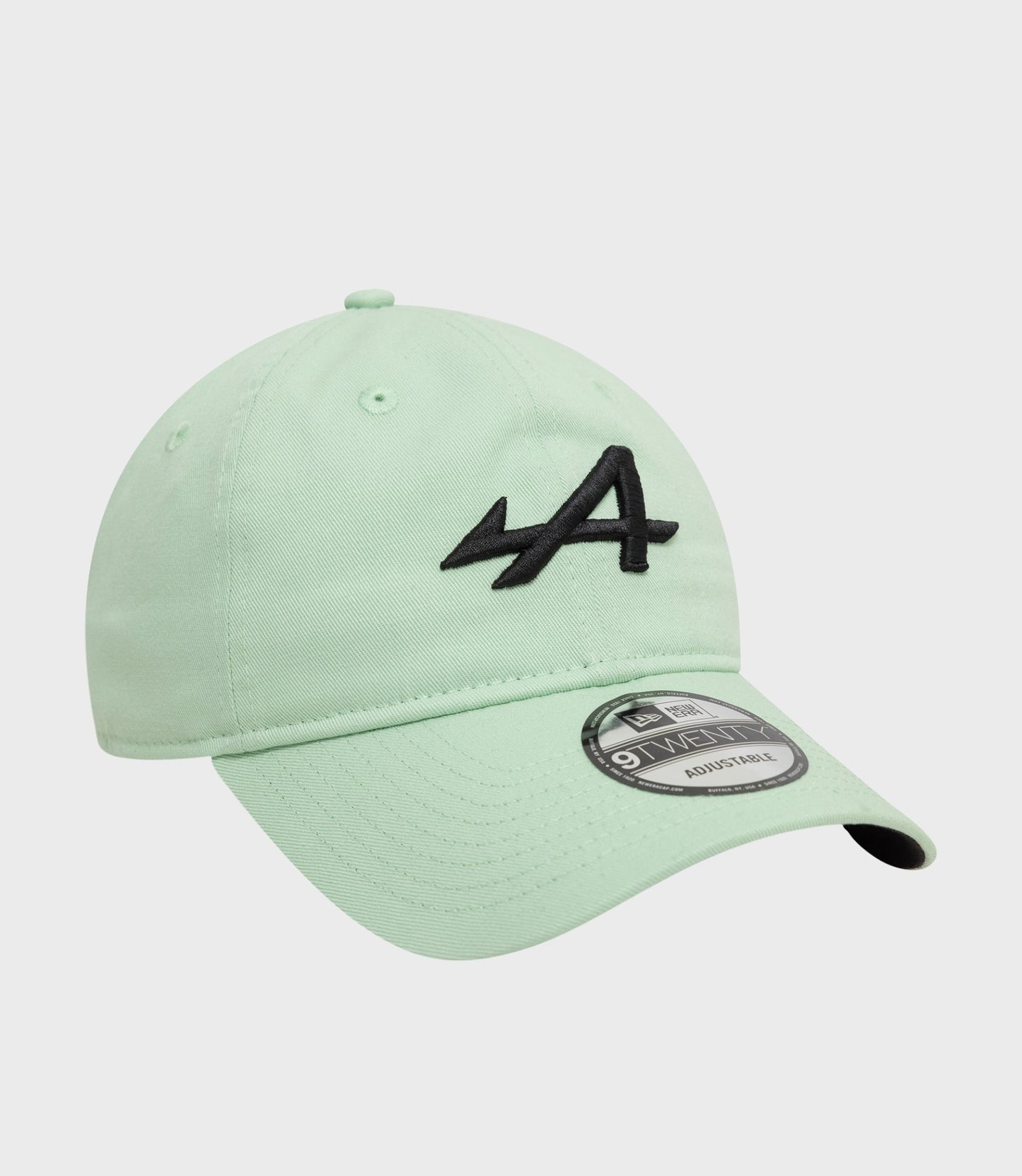 Mint green cap with curved brim and visible brim sticker showcasing adjustable 9Twenty design.