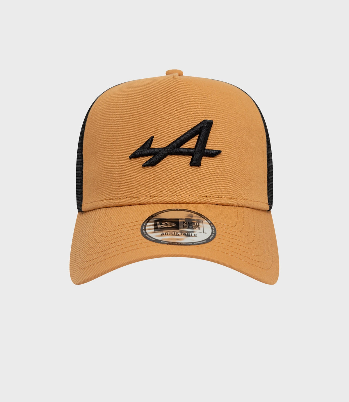 Beige Alpine Seasonal E-Fame Trucker Cap with tan crown and black mesh; front logo embroidery and adjustable brim sticker visible
