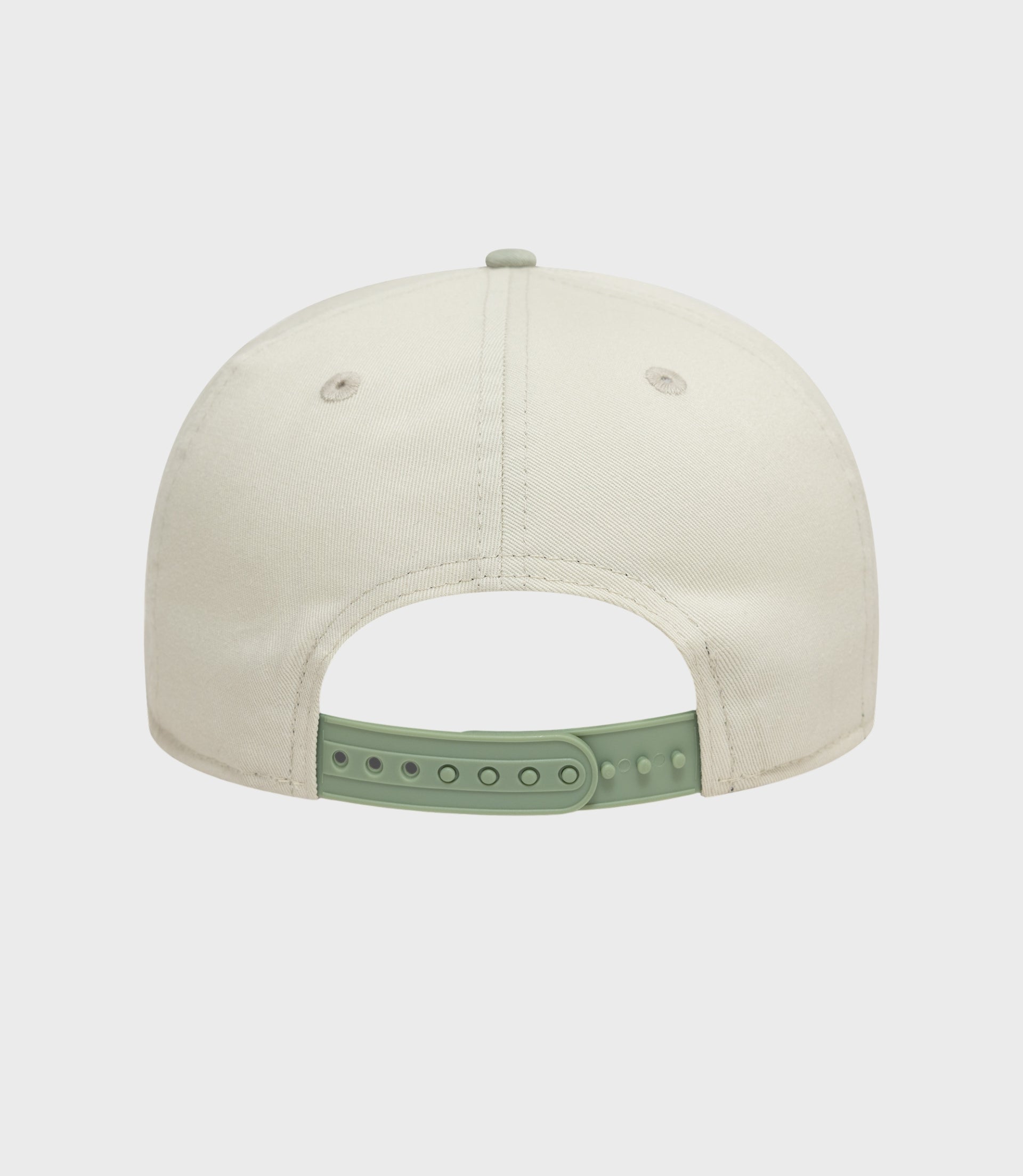 Rear view of white New Era Alpine acid wash golfer cap with a mint green adjustable strap.
