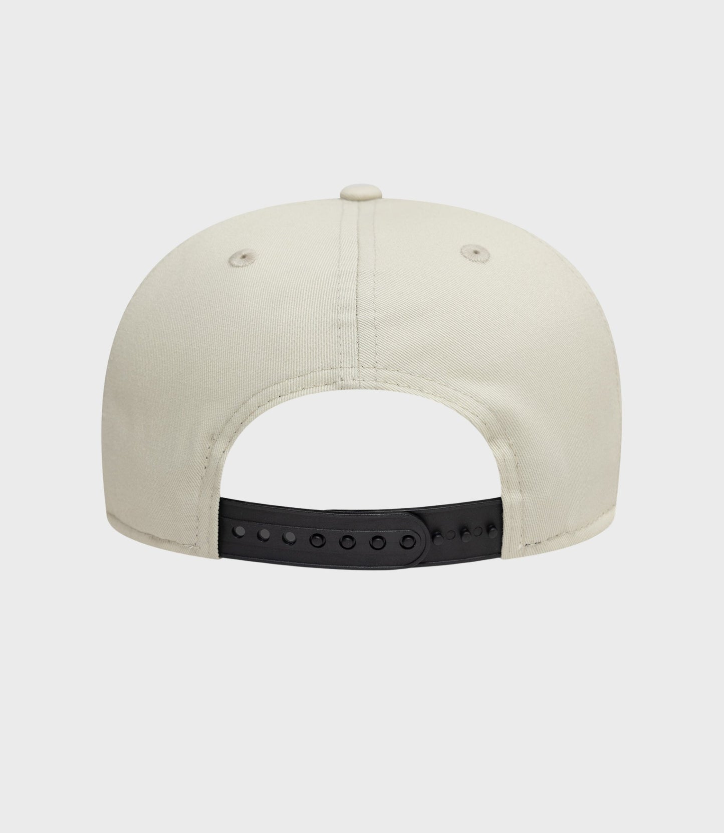 Rear view of cream New Era Alpine Seasonal 9Fifty Pre-Curve cap with a black adjustable strap.