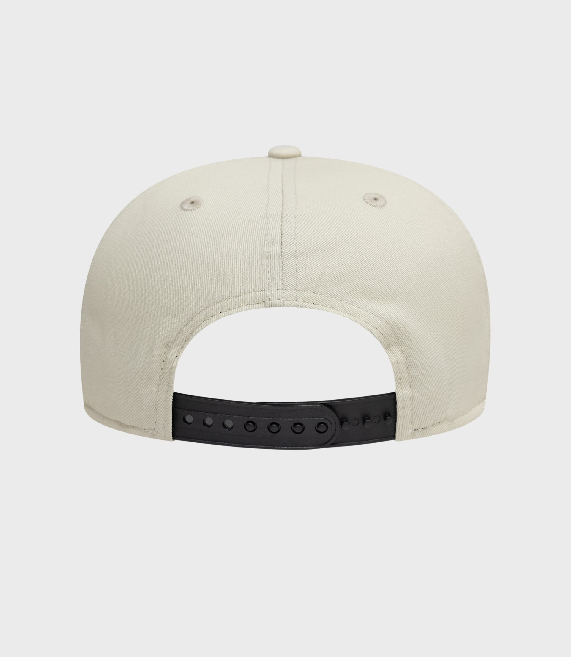 Rear view of cream New Era Alpine Seasonal 9Fifty Pre-Curve cap with a black adjustable strap.