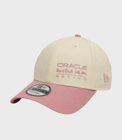 Light beige New Era Oracle Red Bull Racing 9Forty cap with pink top button and pink underbill.