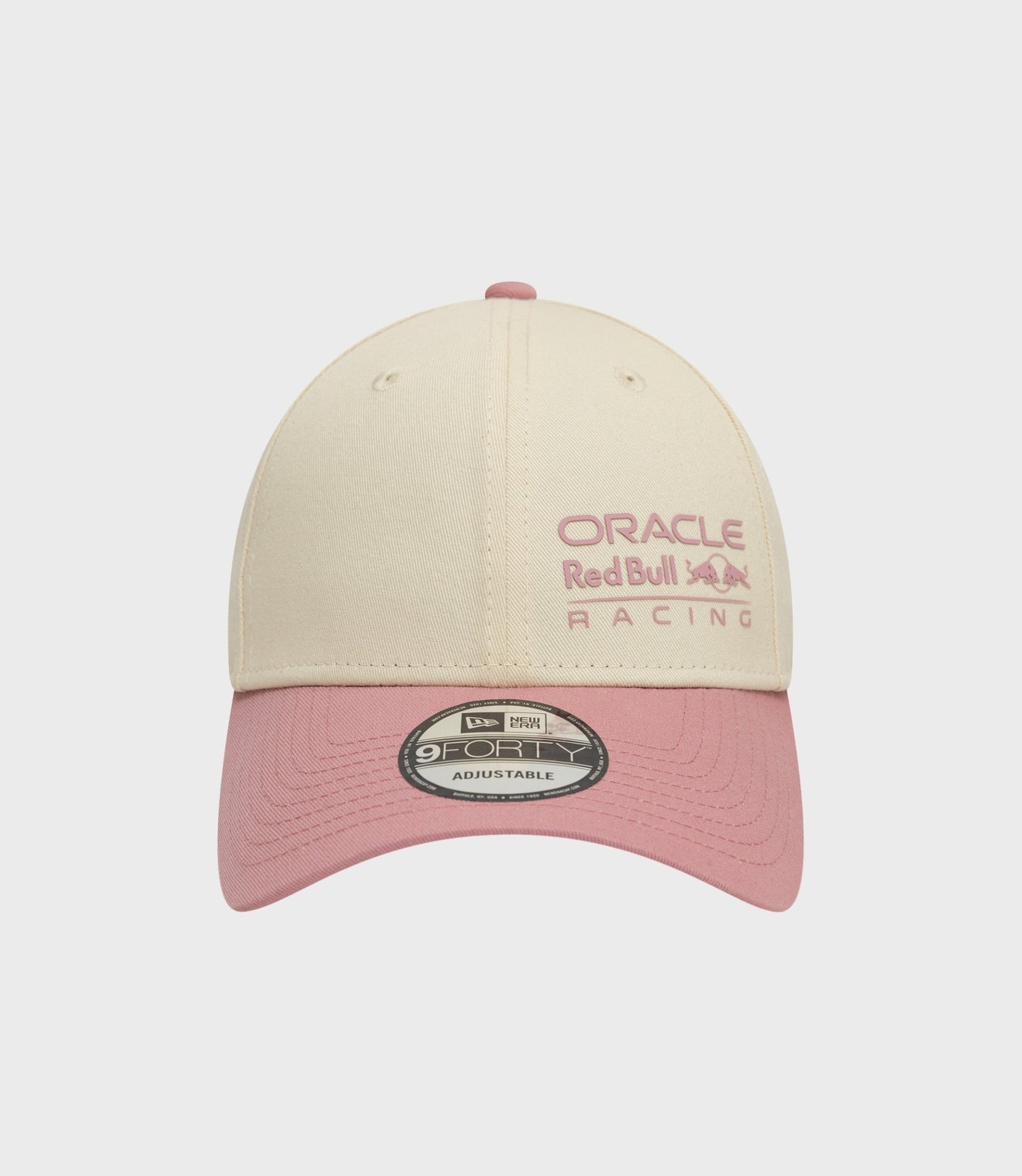 Beige Oracle Red Bull Racing 9Forty cap with pink embroidery and pink brim.