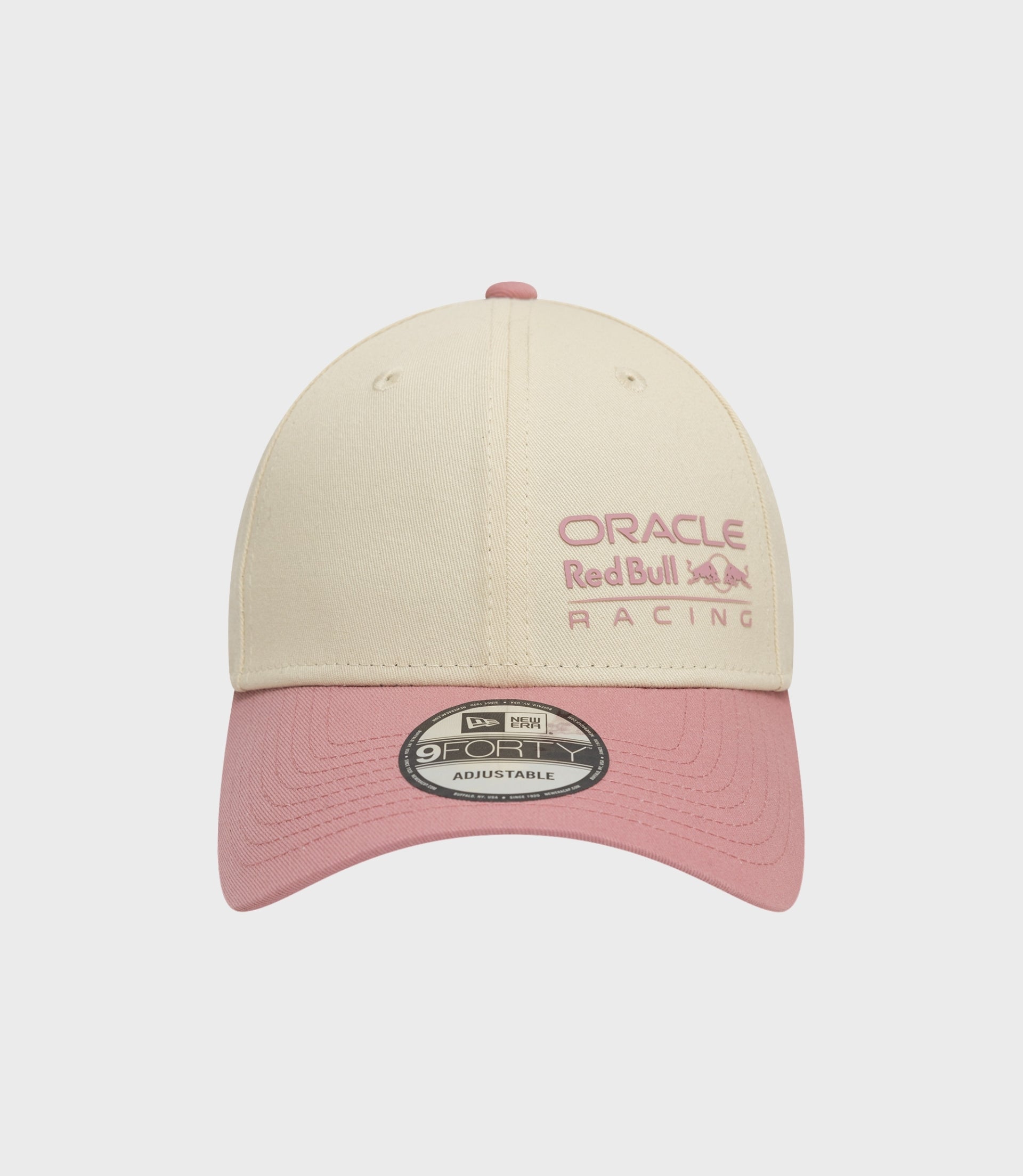 Beige Oracle Red Bull Racing 9Forty cap with pink embroidery and pink brim.