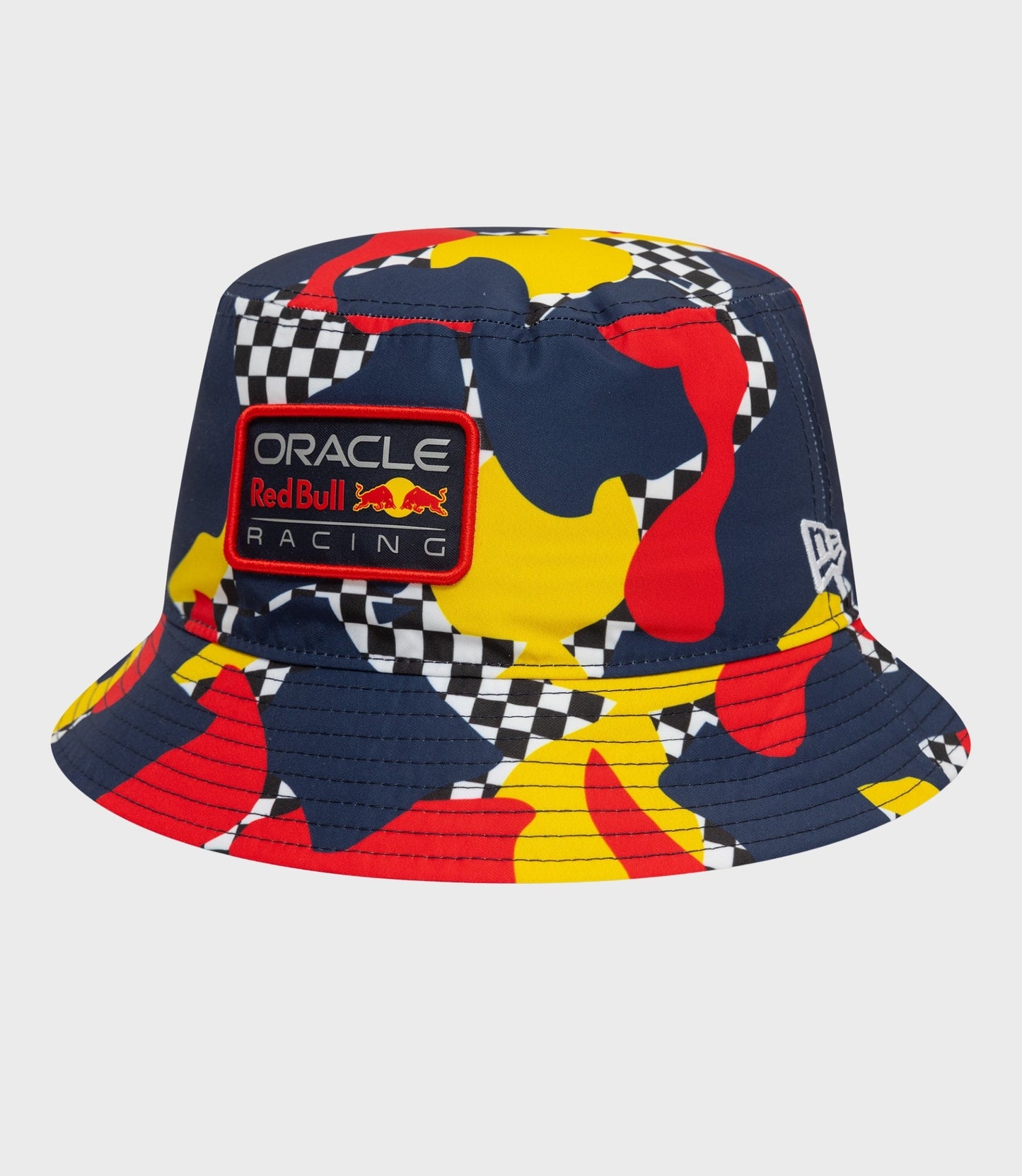 Dark blue abstract patterned bucket hat with colorful shapes and an Oracle Red Bull Racing patch on the front.