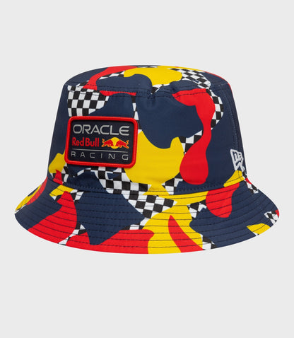 Dark blue abstract patterned bucket hat with colorful shapes and an Oracle Red Bull Racing patch on the front.
