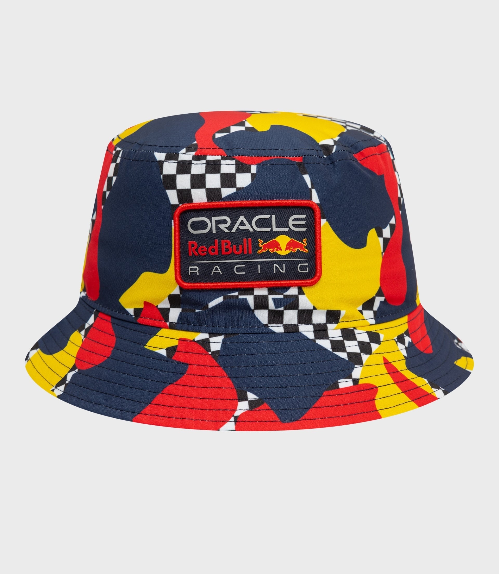 Close up of a dark blue abstract bucket hat with colorful shapes and Oracle Red Bull Racing patch on the front.
