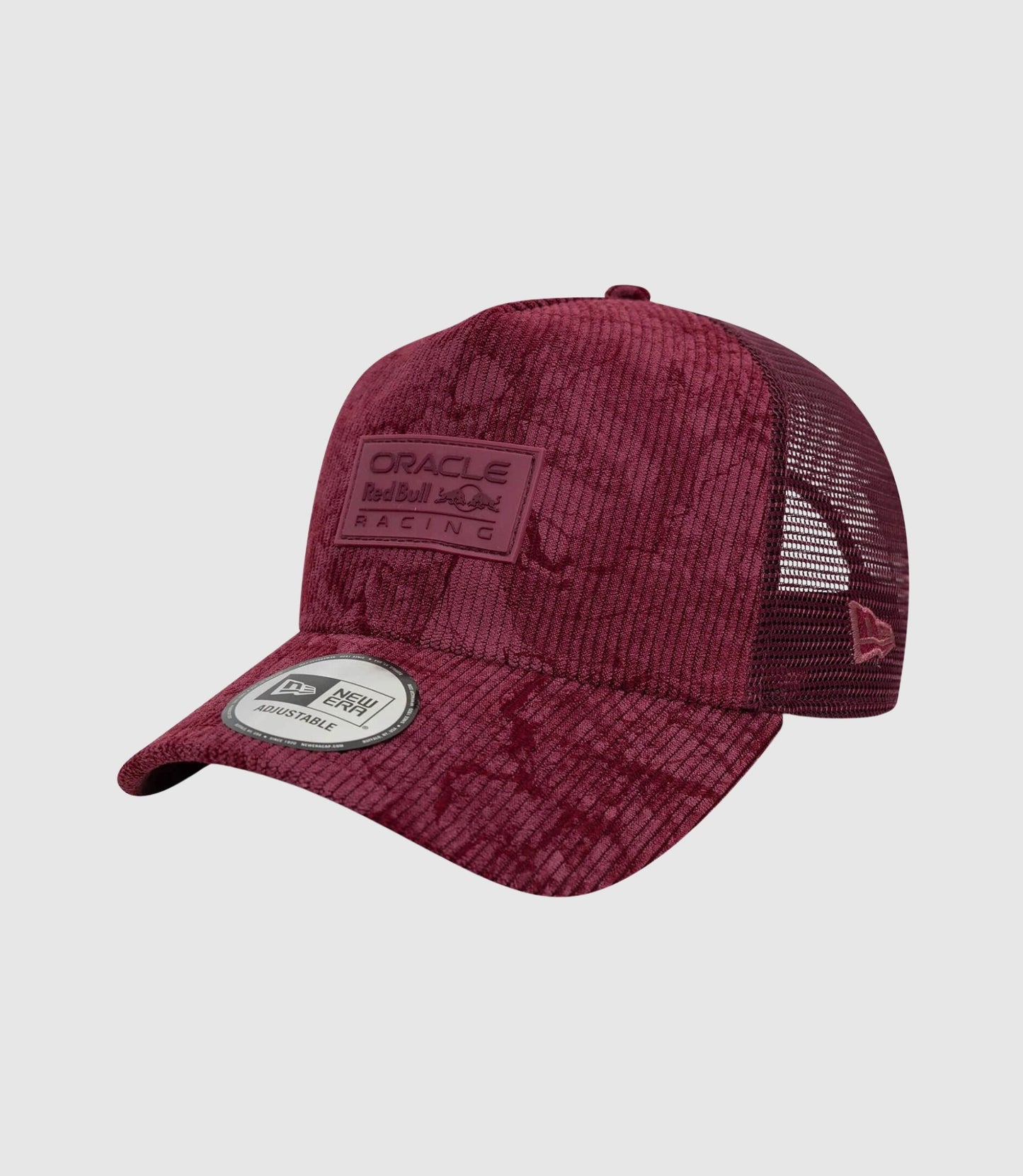 Top view of burgundy corduroy cap crown with small center button