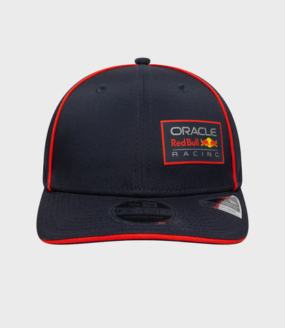 Side front view of navy cap with Oracle Red Bull Racing patch and red piping along the crown