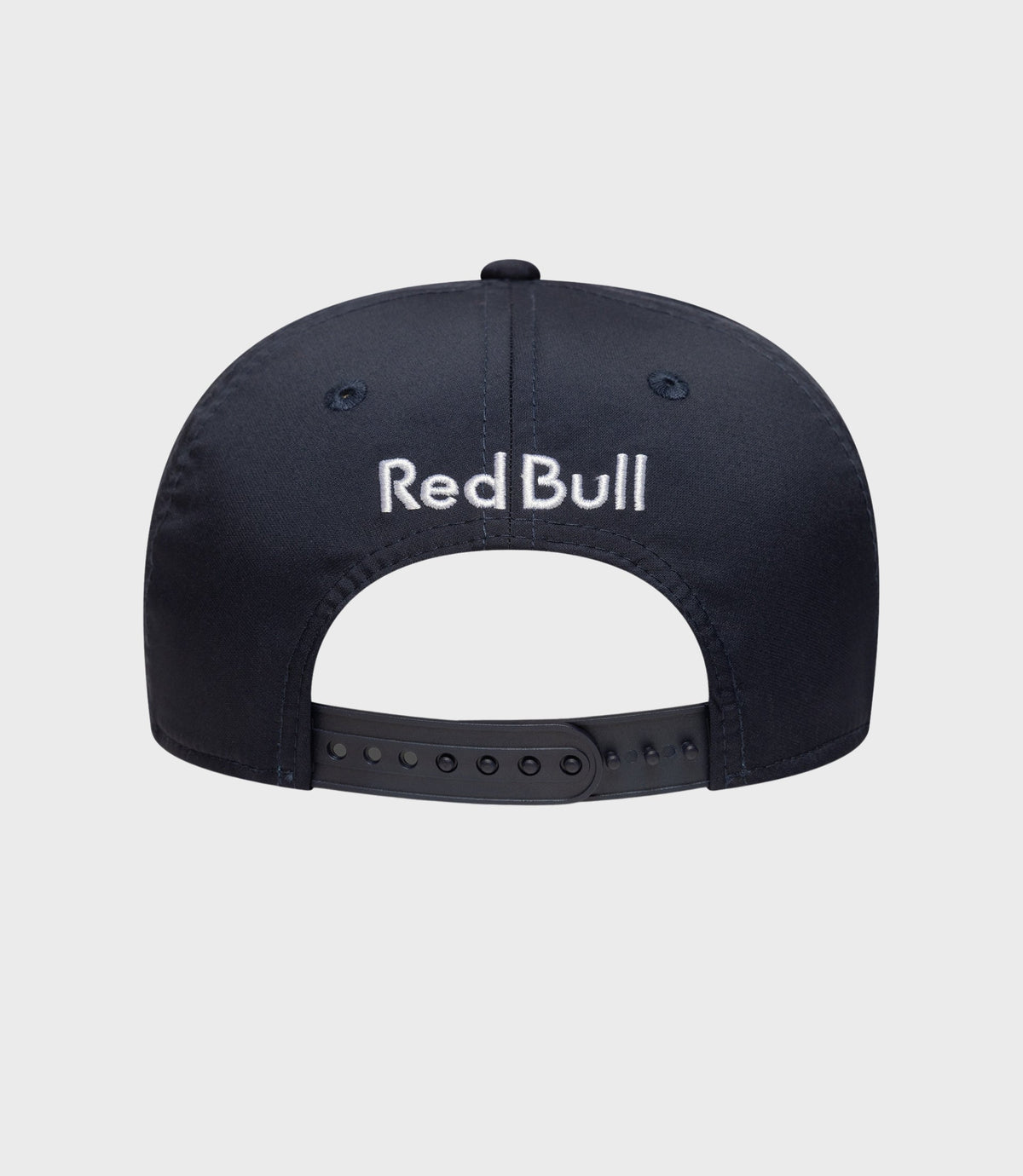 Side view of navy blue 9Seventy cap with red piping and Red Bull Racing badge.