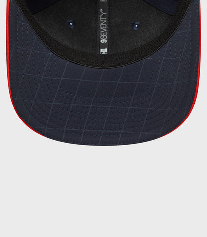 Back interior view of navy blue cap with adjustable strap and 9Seventy label along the back seam.