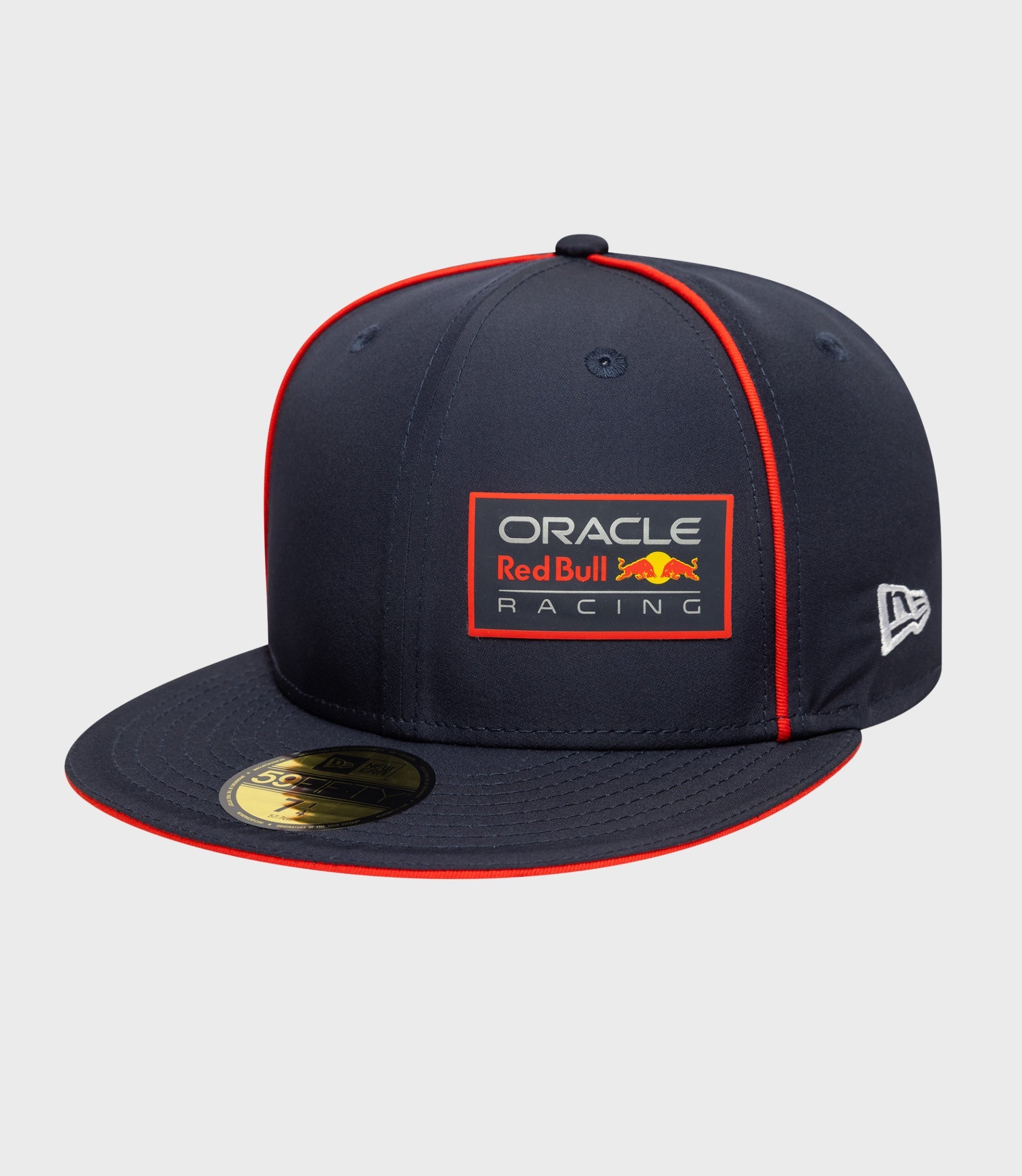 Dark blue New Era 59FIFTY cap with bright red piping and Oracle Red Bull Racing patch on the front.