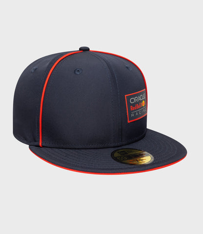 Close up of navy blue cap with red piping, front Oracle Red Bull Racing badge and brim sticker.