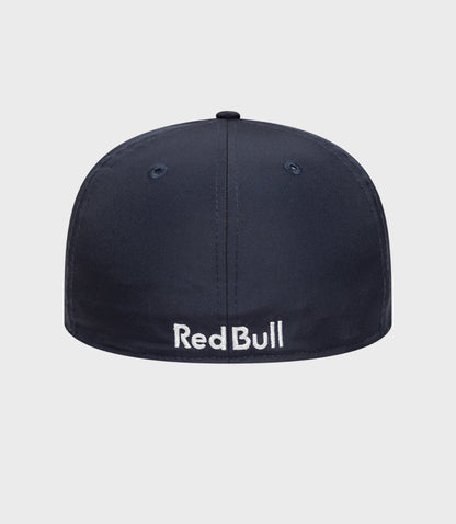 Top view of a dark blue New Era 59Fifty cap crown with a small button at the center.