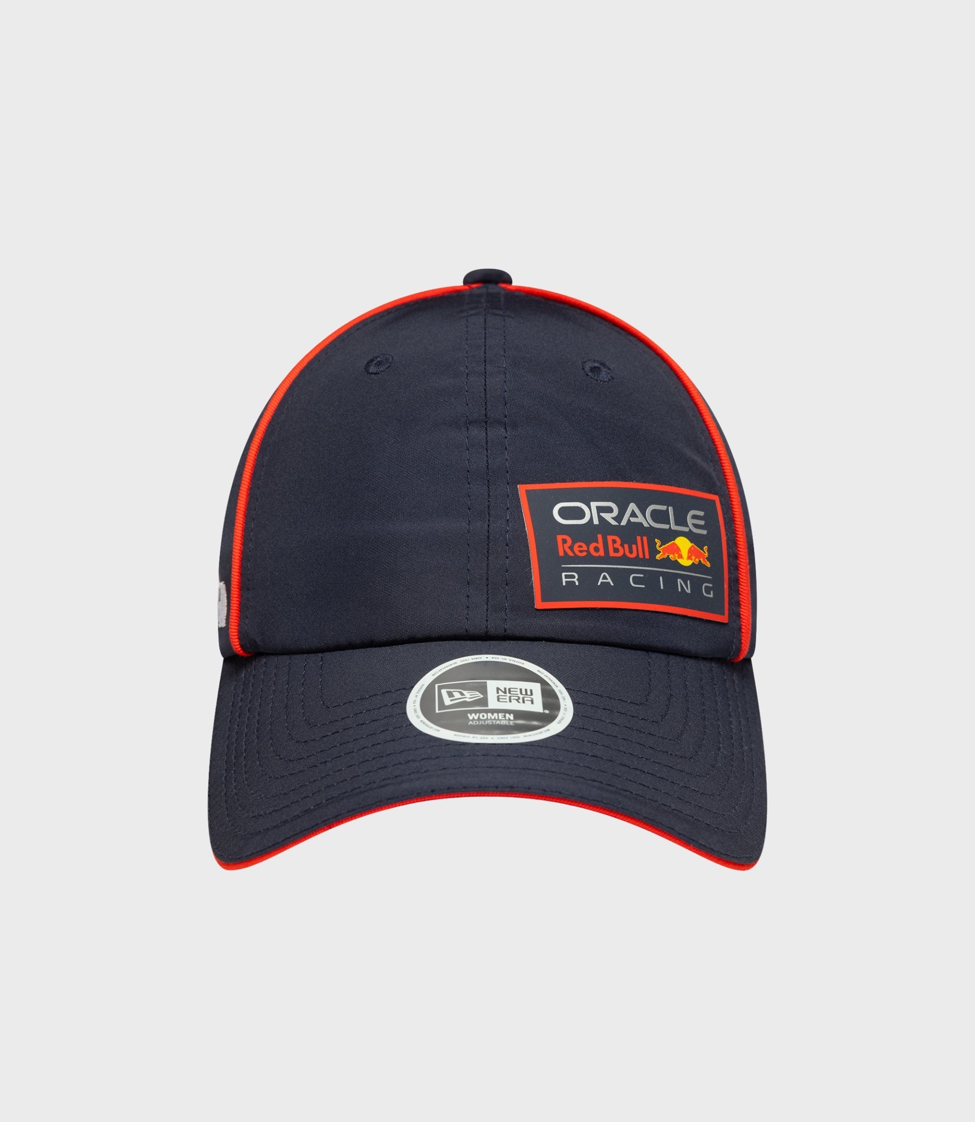Dark blue women's open back cap with red piping and Oracle Red Bull Racing patch on the front