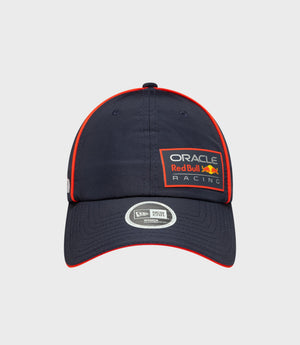 Dark blue women's open back cap with red piping and Oracle Red Bull Racing patch on the front