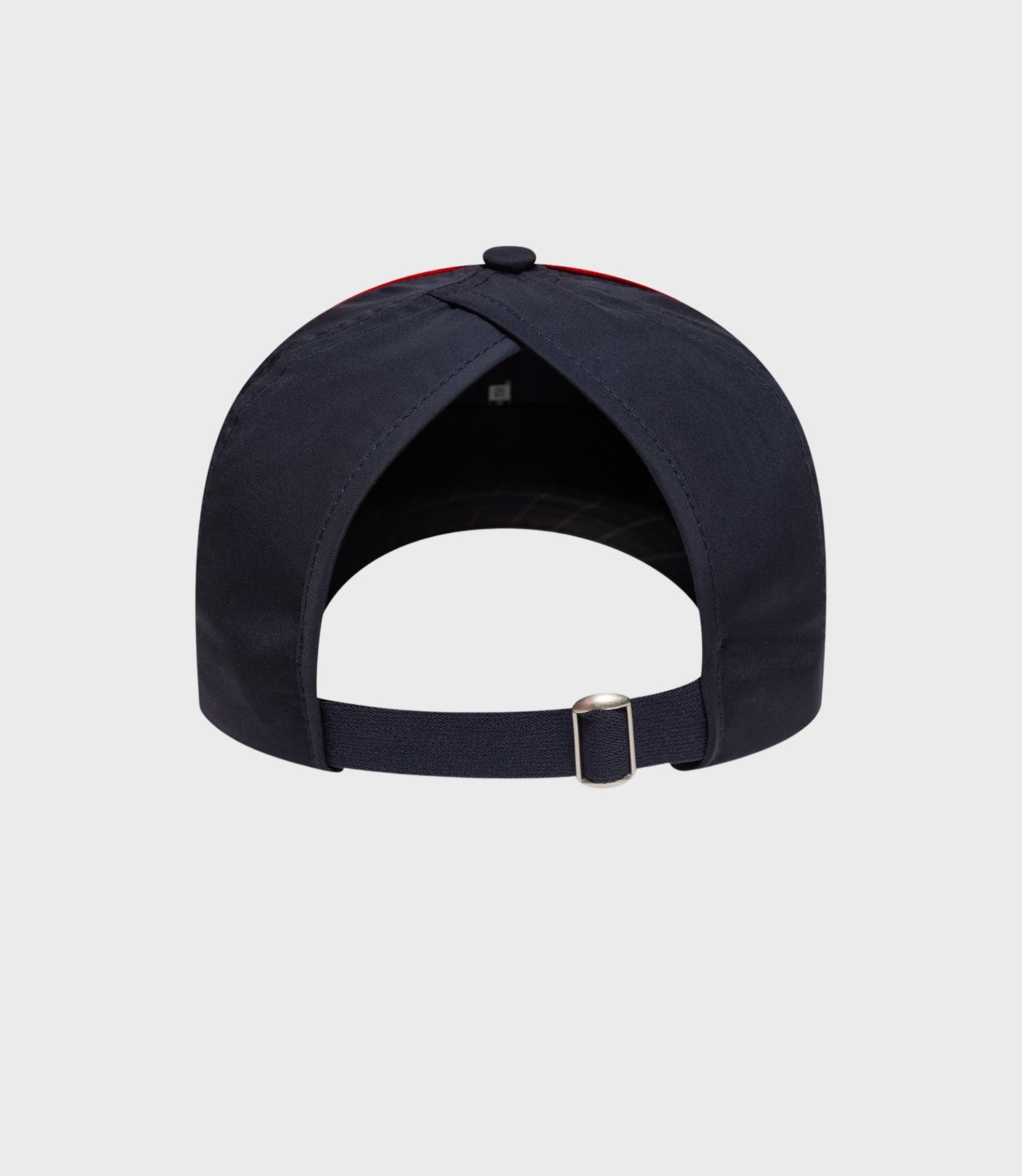 Back view of navy open back cap with red piping and adjustable strap with buckle