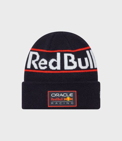Dark blue cuff knitted beanie with acrylic crown and cuff featuring bold Red Bull lettering and a red stripe across front