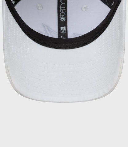 Close up of white New Era 9Forty cap brim with black trim and stitched detailing