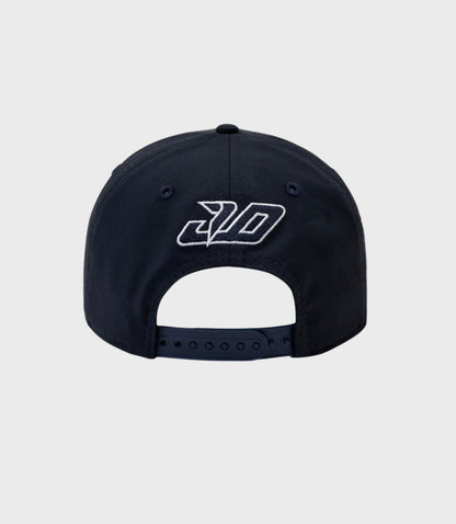 Navy New Era Rep Driver 9Seventy Stretch Snap Cap with white embroidered logo on the front