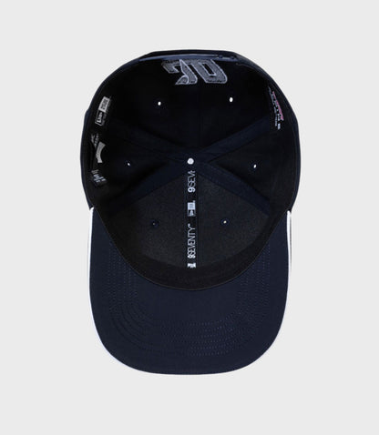 Interior view of navy New Era Rep Driver 9Seventy Stretch Snap Cap showing branding and adjustable strap