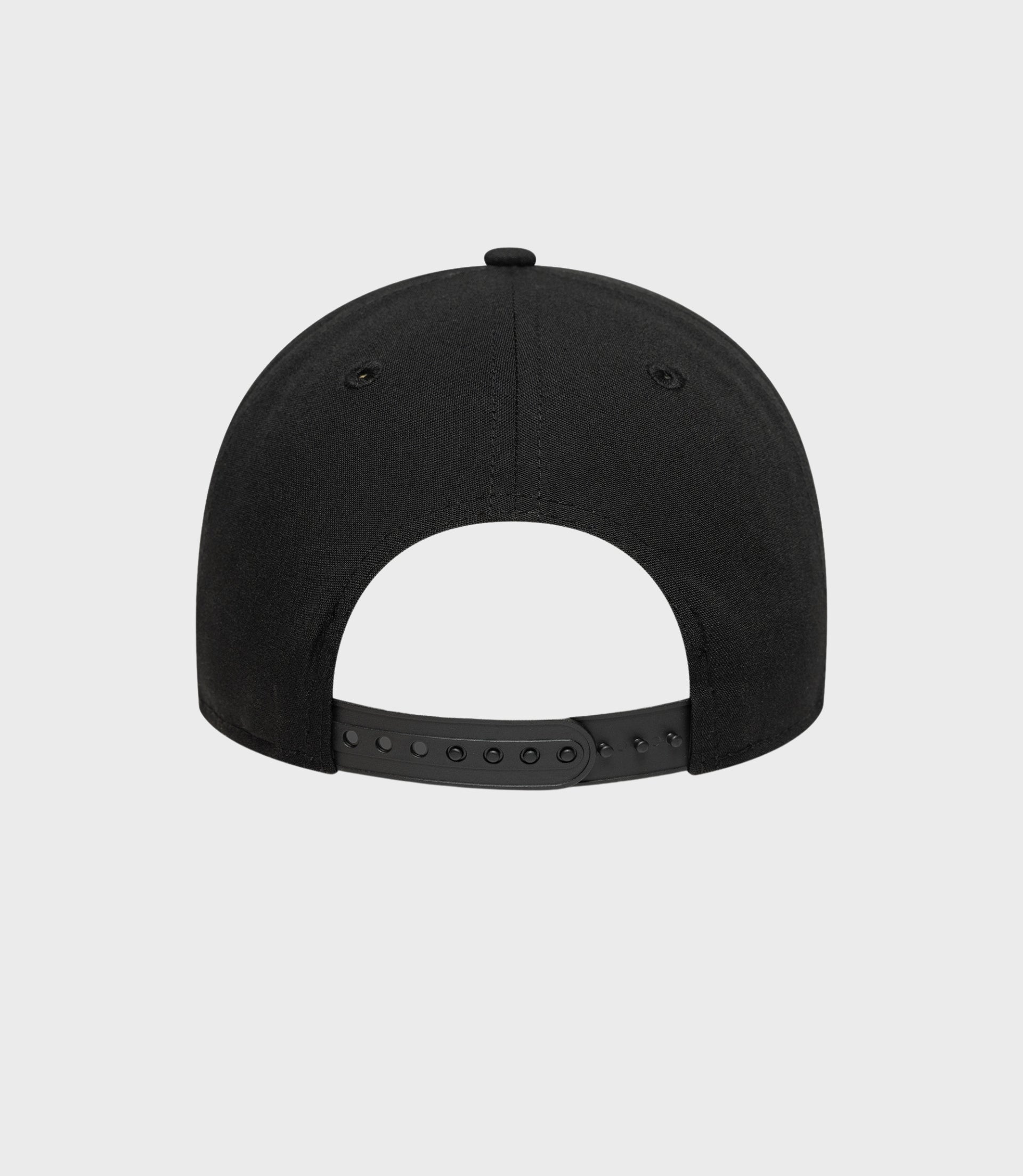 Rear view of black Estretch Snapential 9Forty cap showing adjustable snapback strap