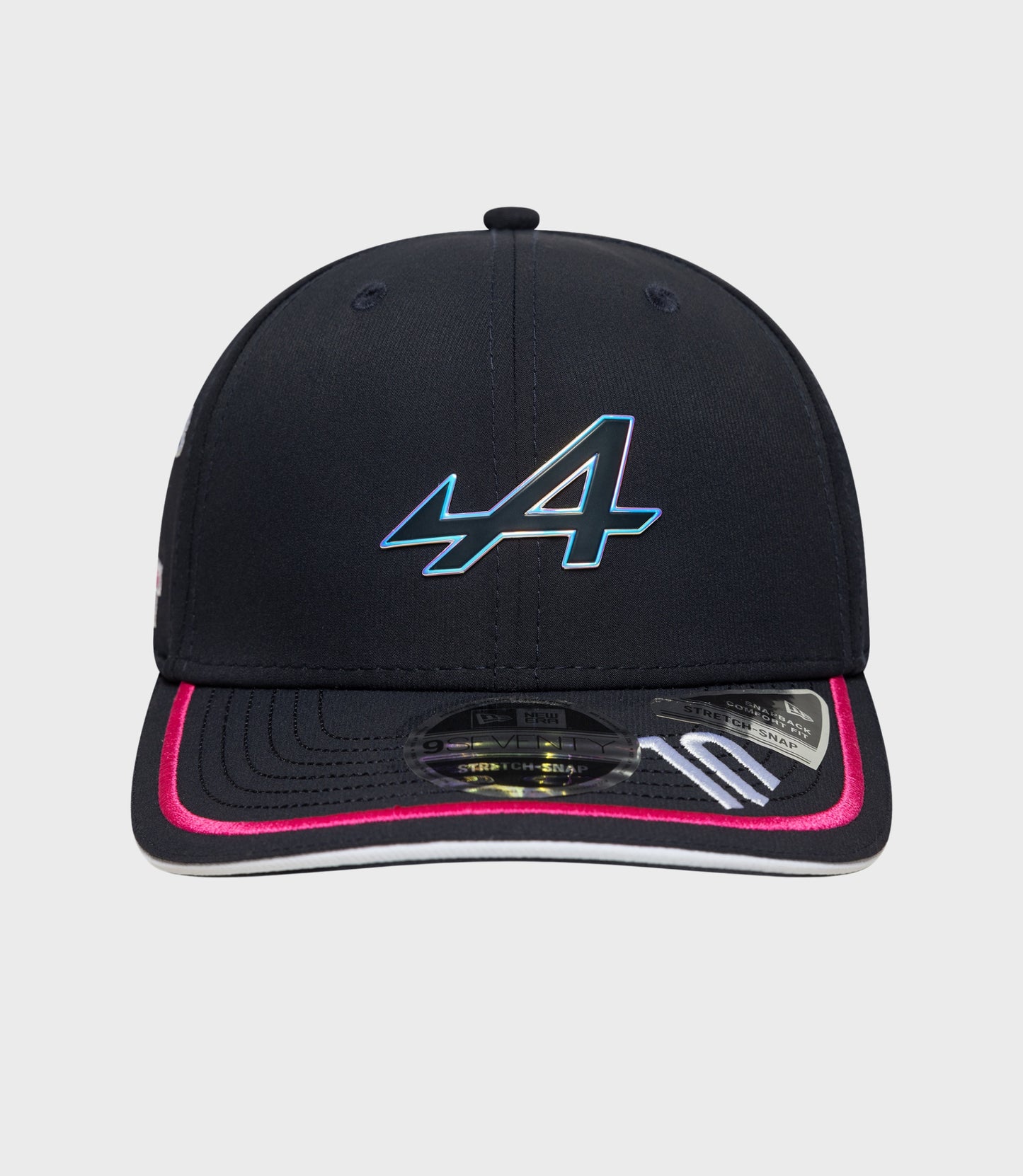 Close up of navy cap crown showing stitched panels and a small top button