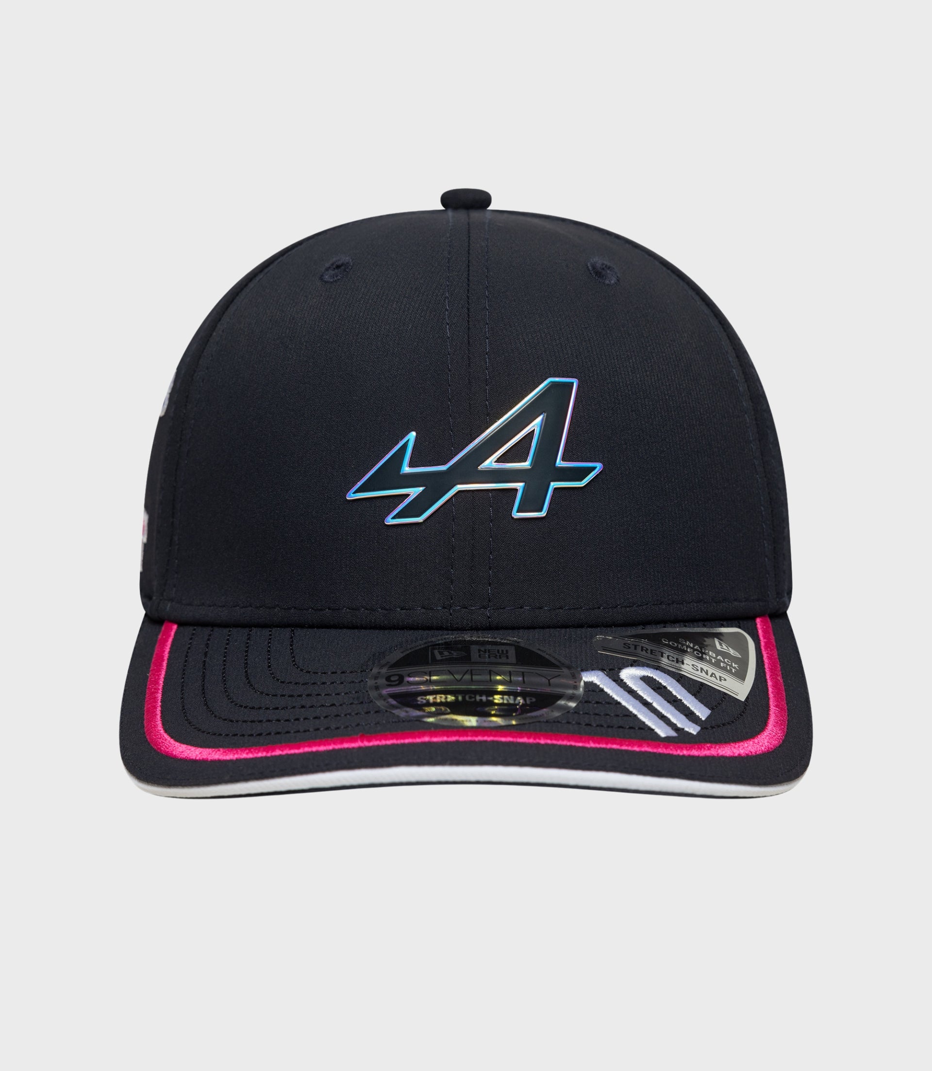 Close up of navy cap crown showing stitched panels and a small top button