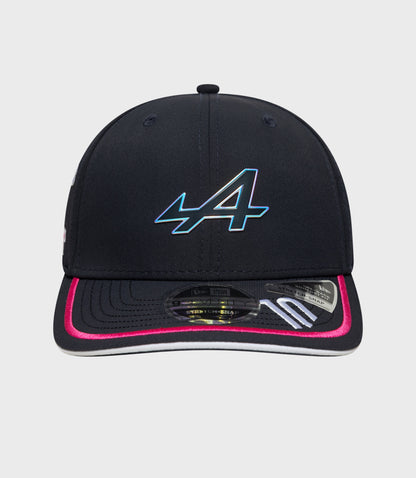 Close up of navy cap crown showing stitched panels and a small top button