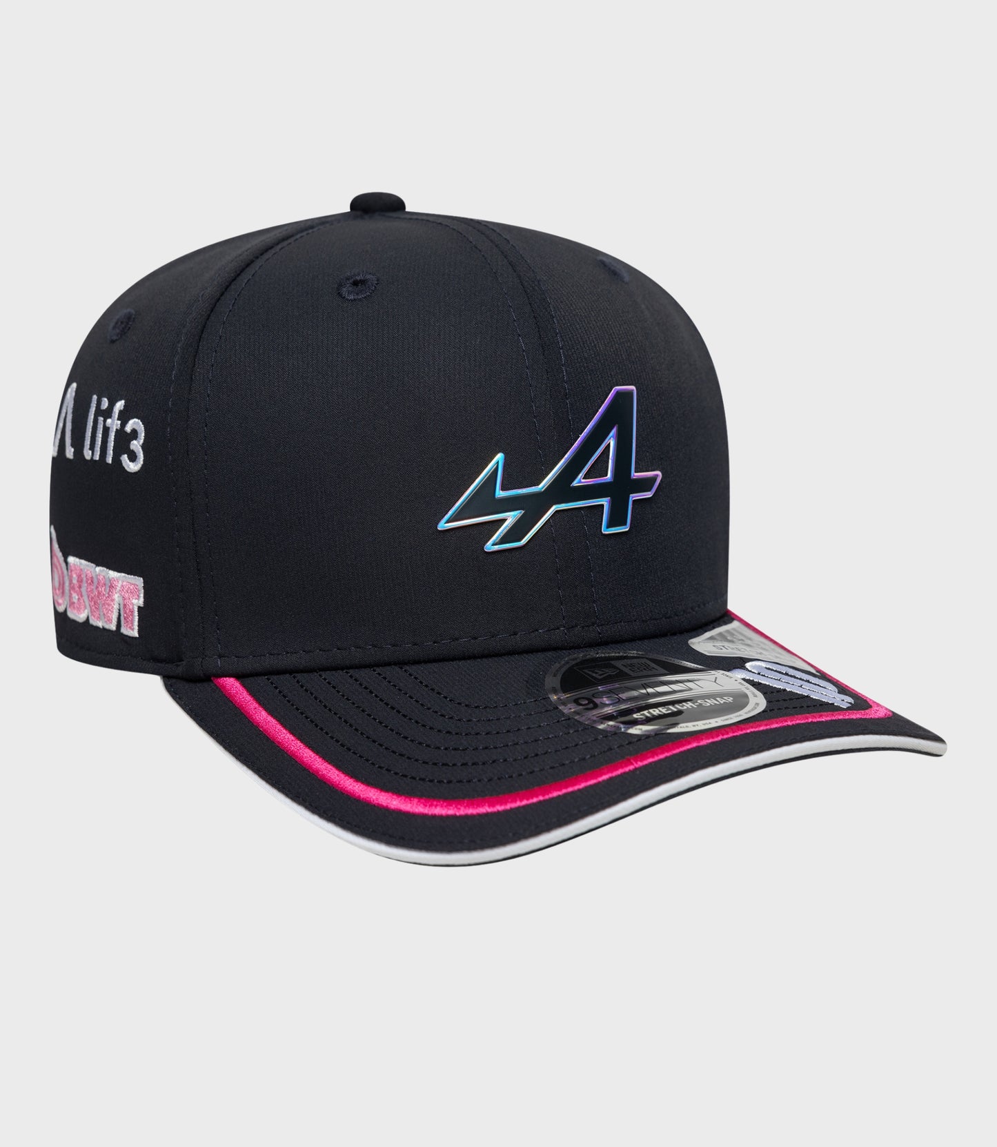 Close-up of navy cap with a colorful embroidered graphic on the side of the crown