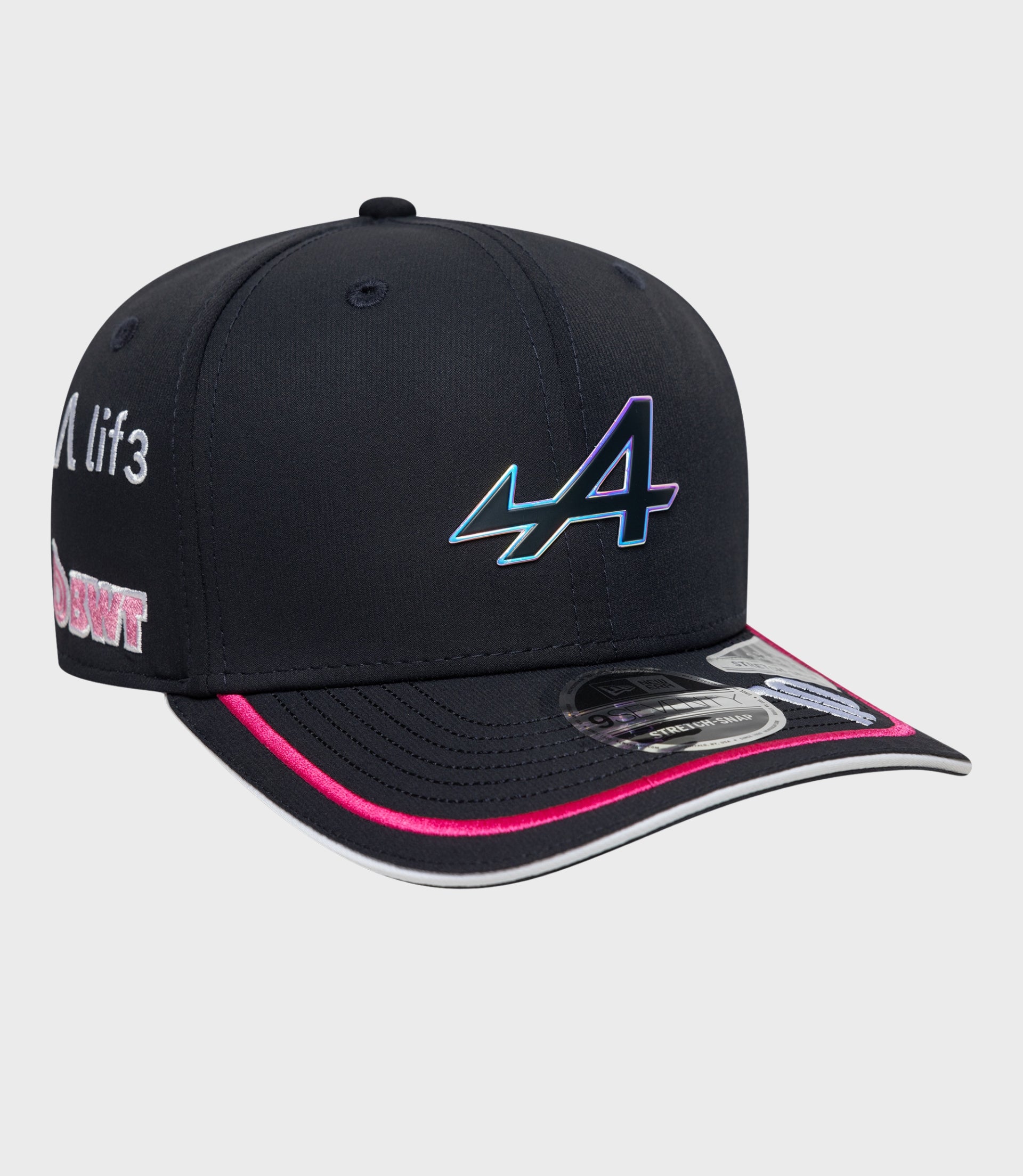 Close-up of navy cap with a colorful embroidered graphic on the side of the crown