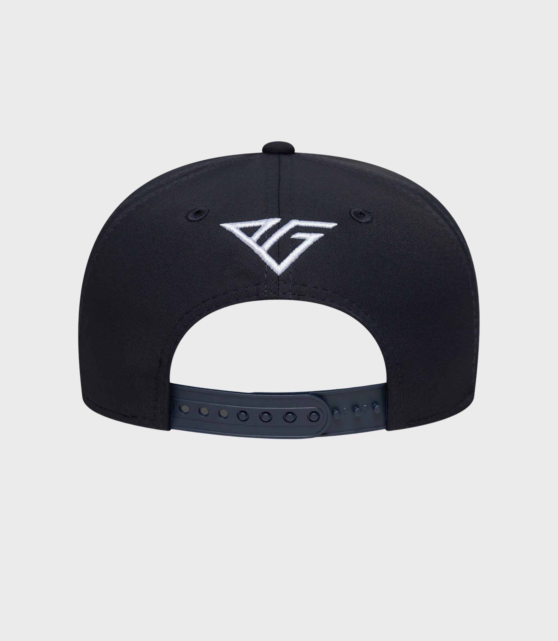 Back view of navy cap showing white embroidered emblem and adjustable snap closure