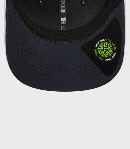 Front view of navy 9Seventy cap with a bright logo patch on the crown and pink piping along the brim