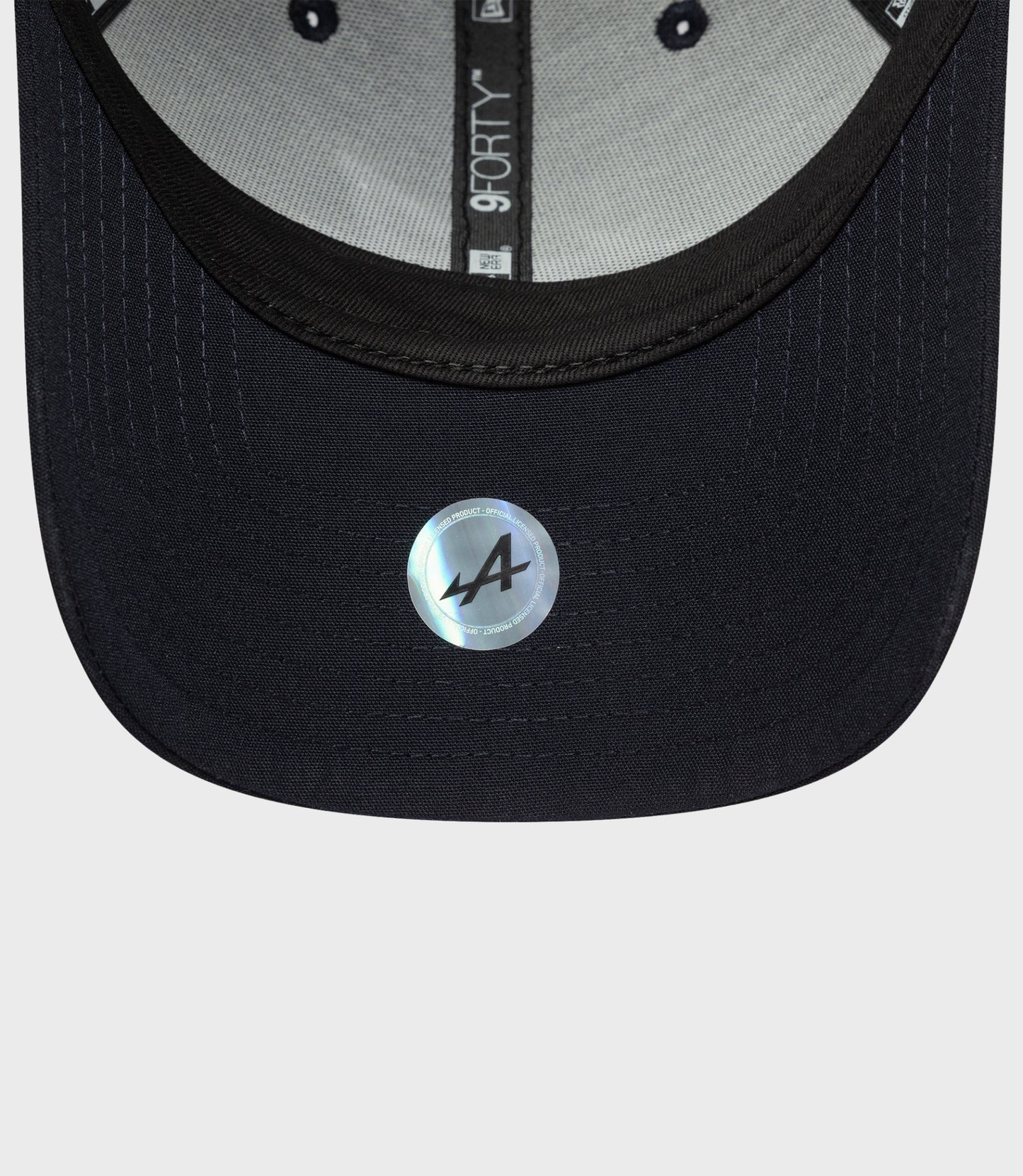 Interior view of navy Repreve 9Forty cap with gray lining and inner label