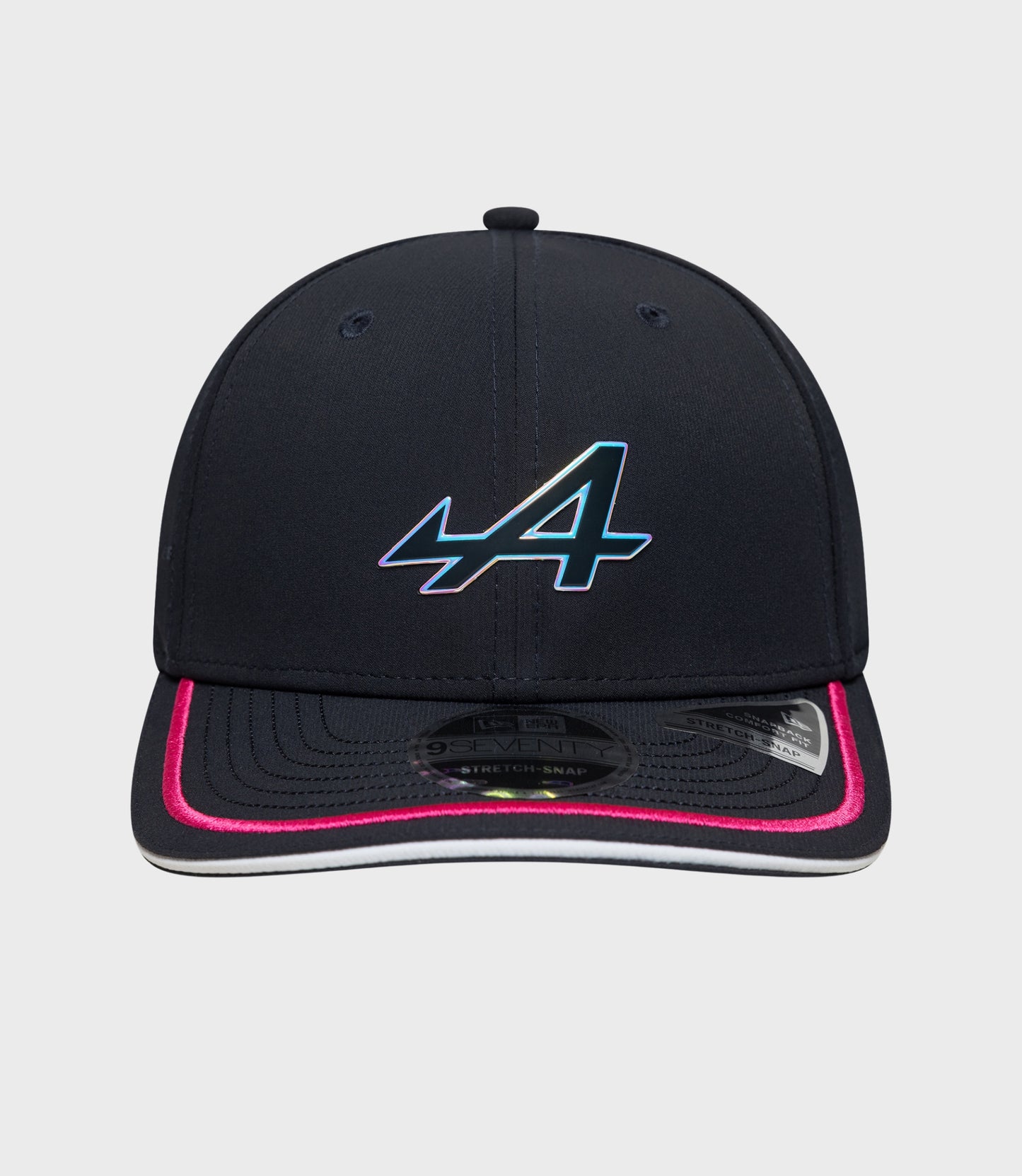 Front view of navy New Era Rep Team 9Seventy Stretch Snap cap with gradient logo on the front and pink piping along the brim