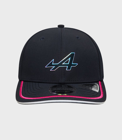 Front view of navy New Era Rep Team 9Seventy Stretch Snap cap with gradient logo on the front and pink piping along the brim